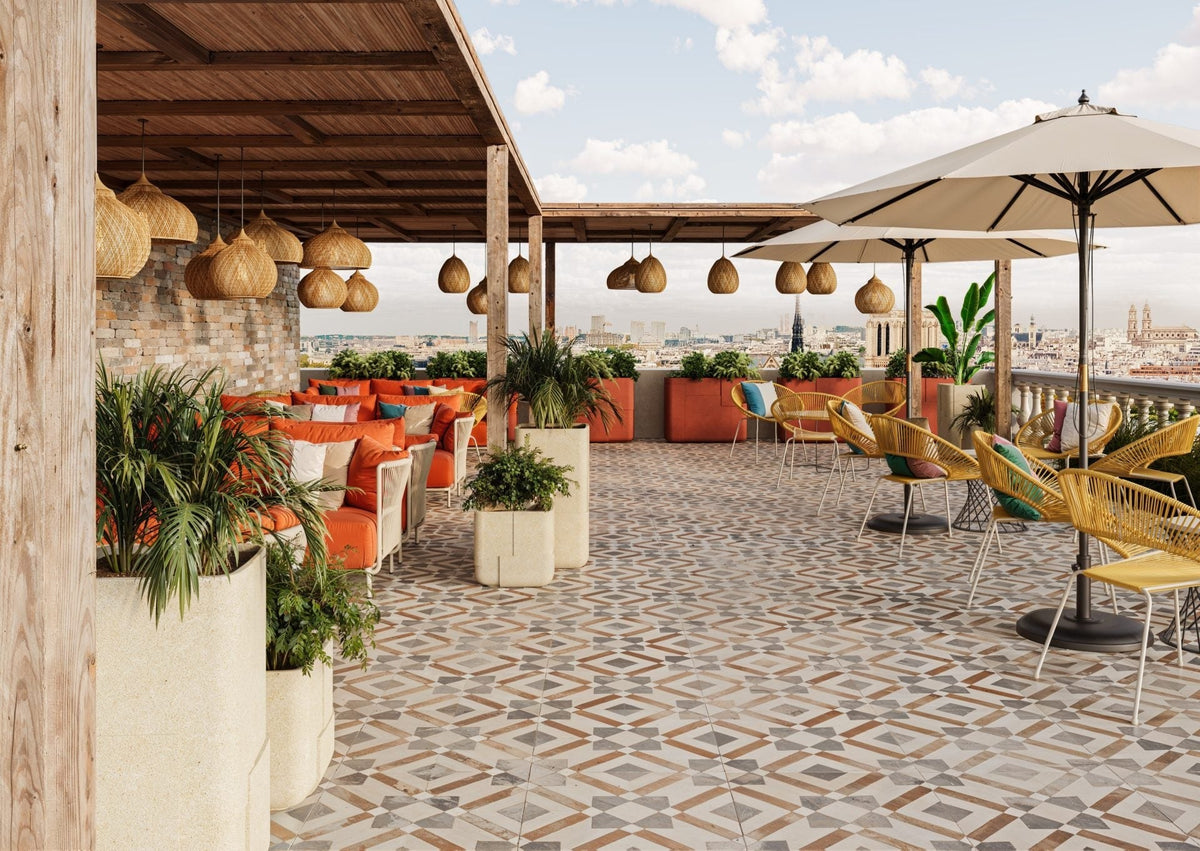 Indigenus Aarde planters, designed by Sebastian Herkner, on a hospitality terrace