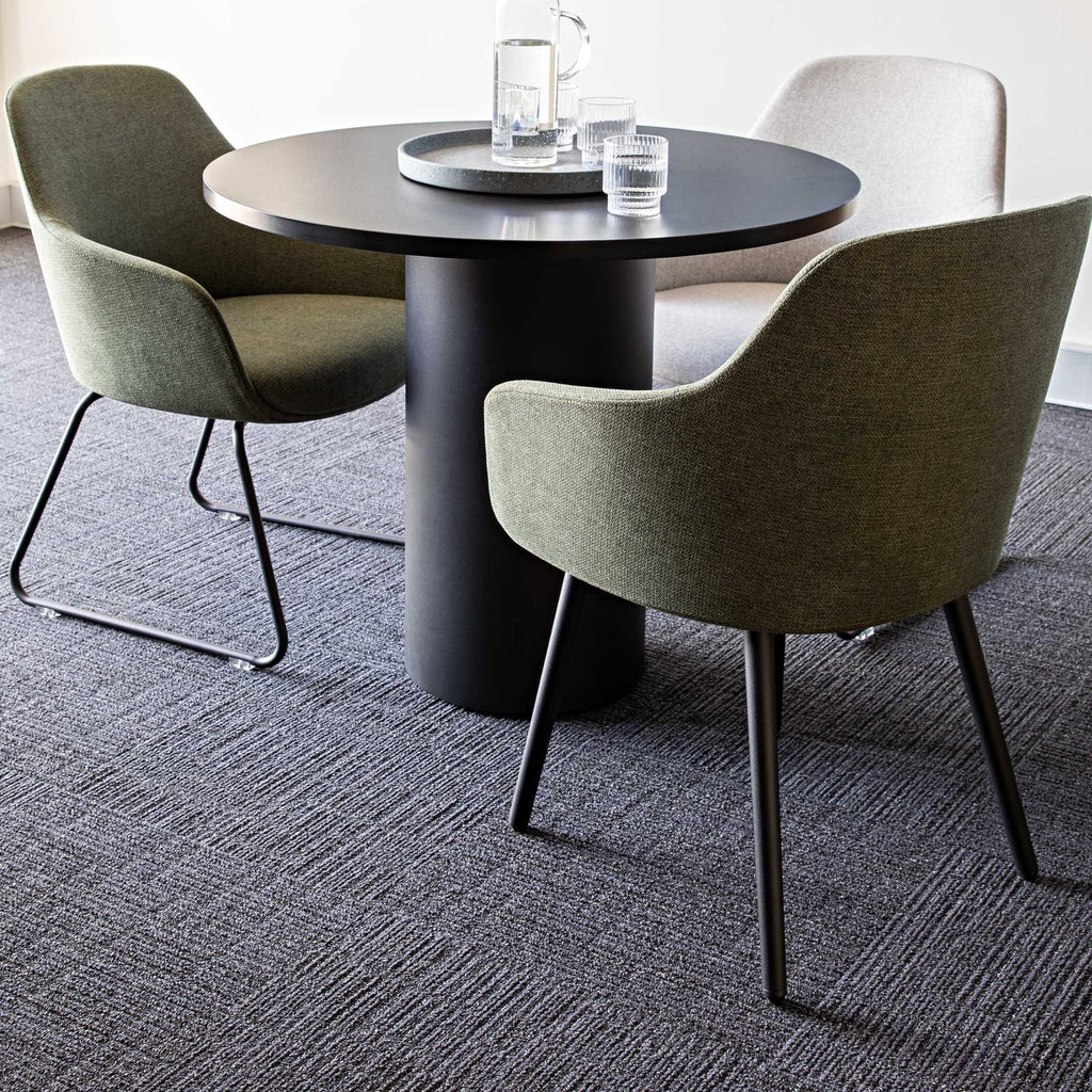 Aspen tub chairs around a round meeting table