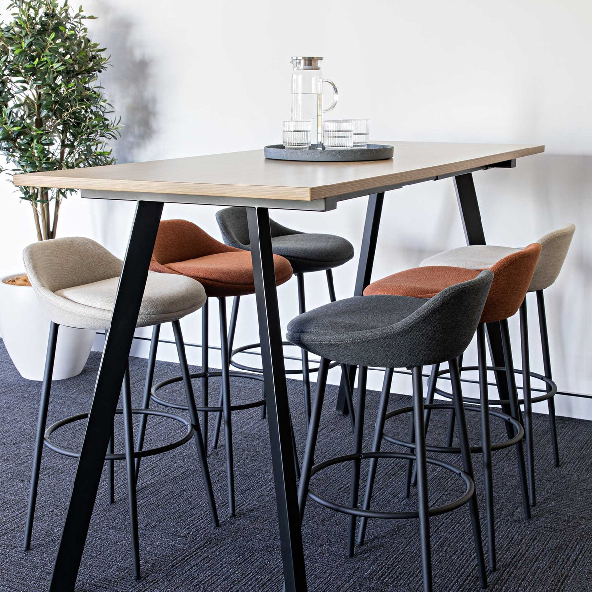 Eros Bar Stool shown in a workplace setting
