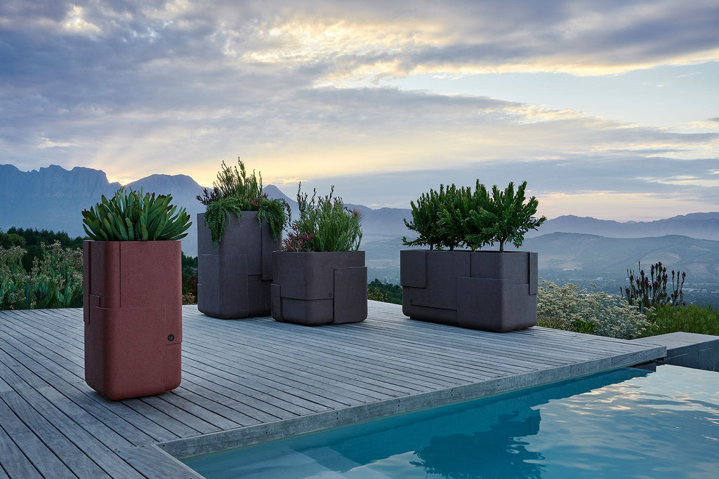 Indigenus Aarde planters on a pool deck with mountain views